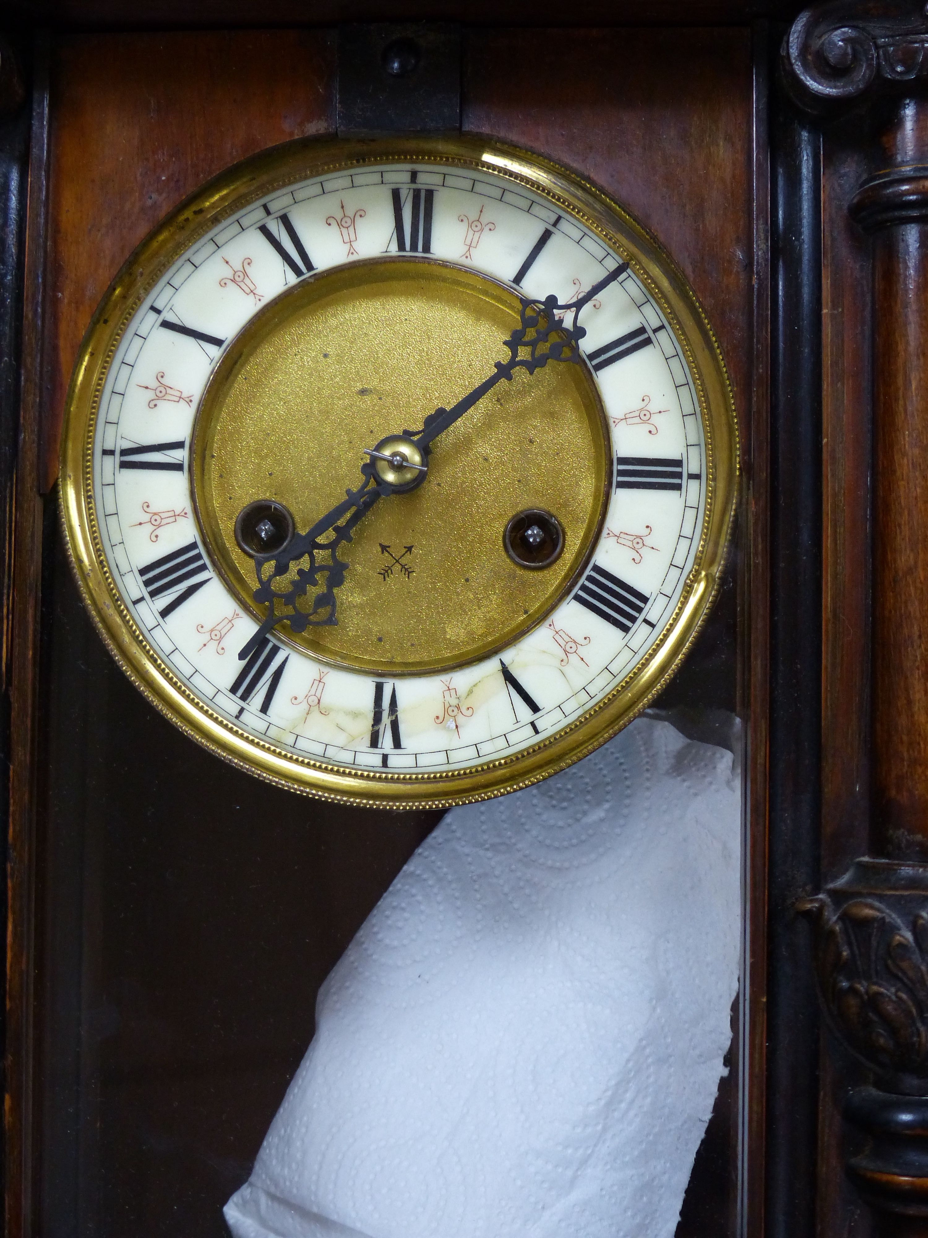 A 19th century German walnut wall clock with pendulum and key, height 58cm, and a mahogany barometer